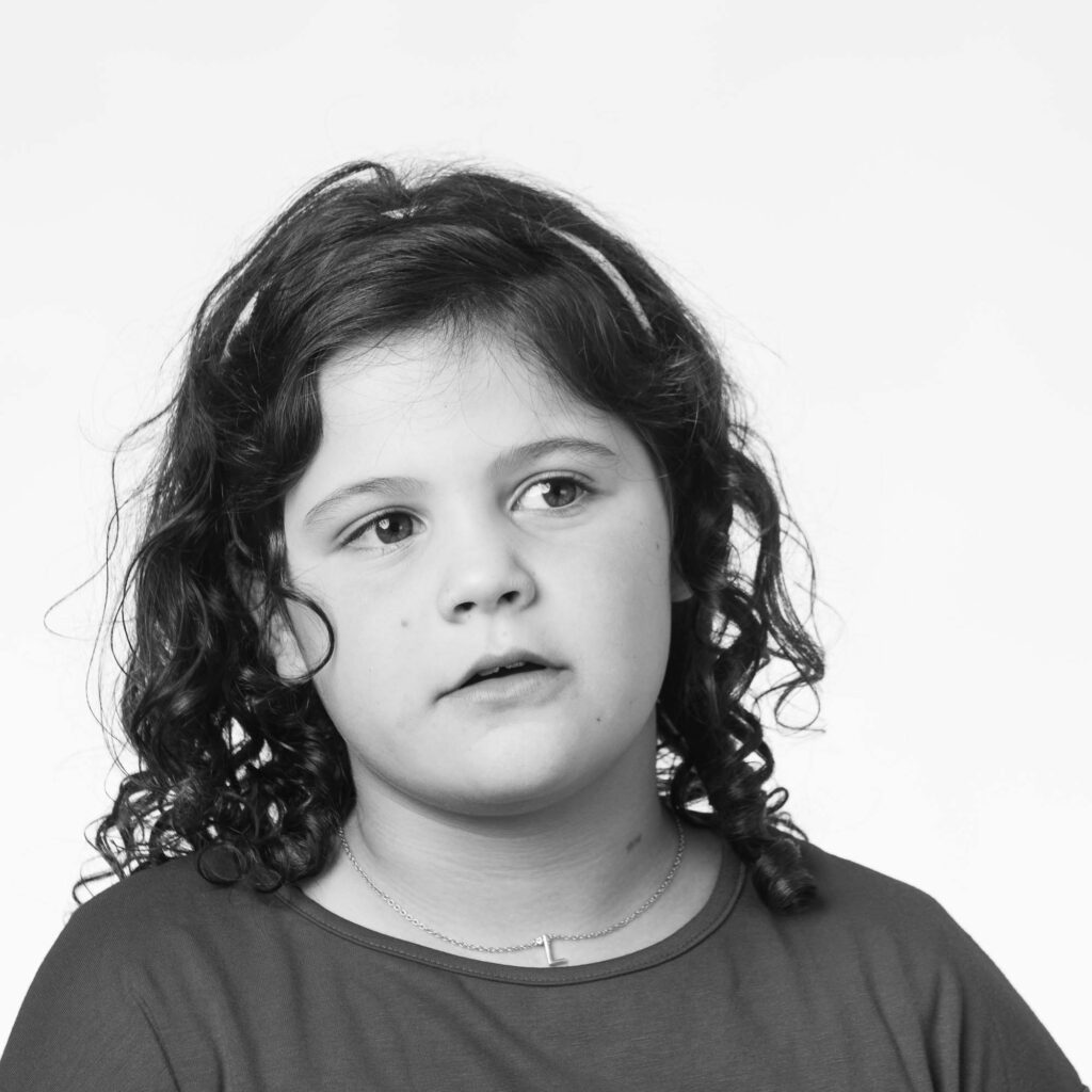Sweet little girl looking off camera during DC studio photography session