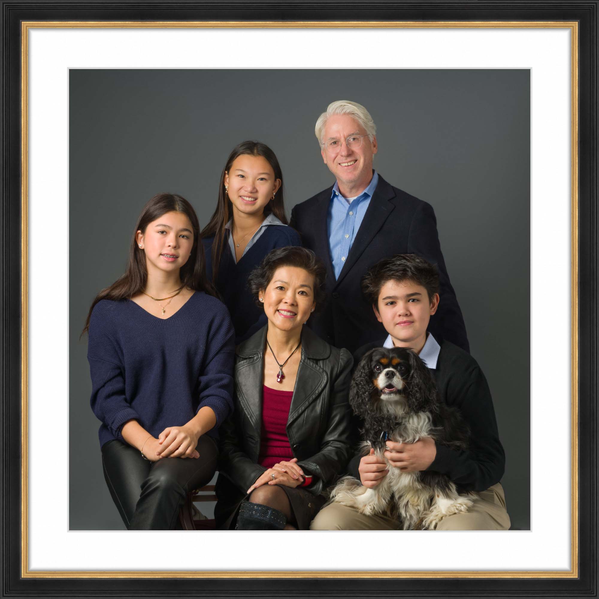 family portrait in elegant black and gold frame