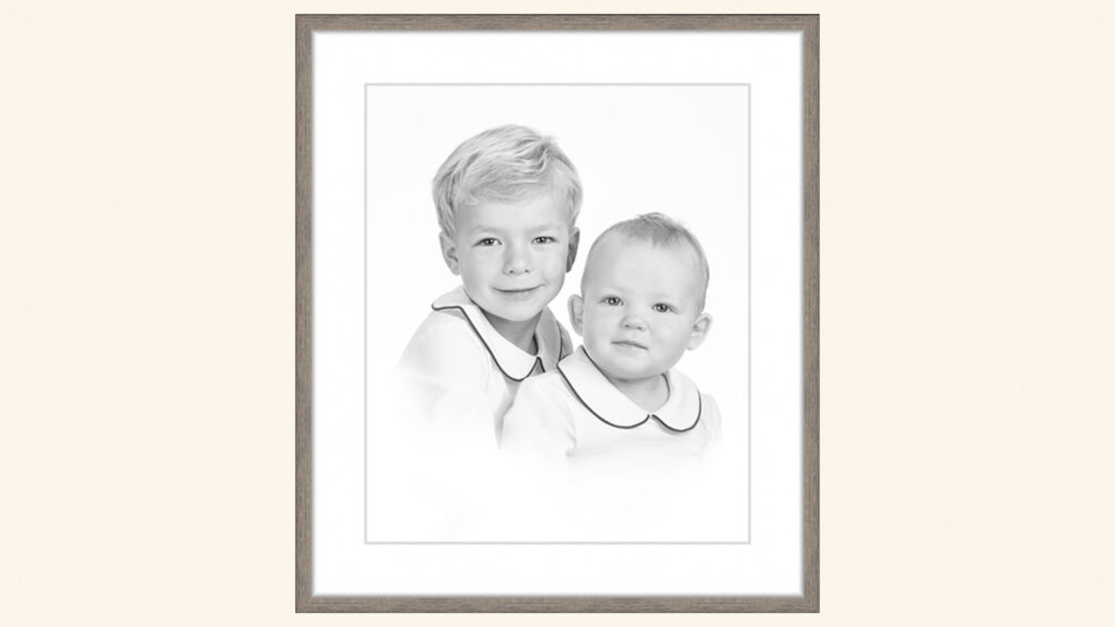 Two young brothers in white collared shirts pose together for a formal black and white Heirloom Portrait | Lisa Maco Photography