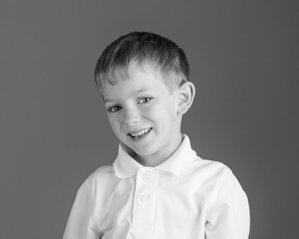 fine art black and white portrait of young boy