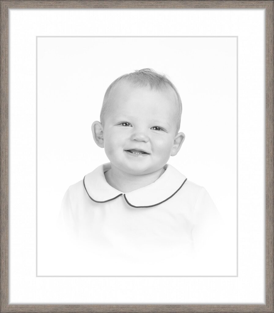 Smiling toddler in a white collared shirt during a classic studio portrait session with DC family photographer Lisa Maco