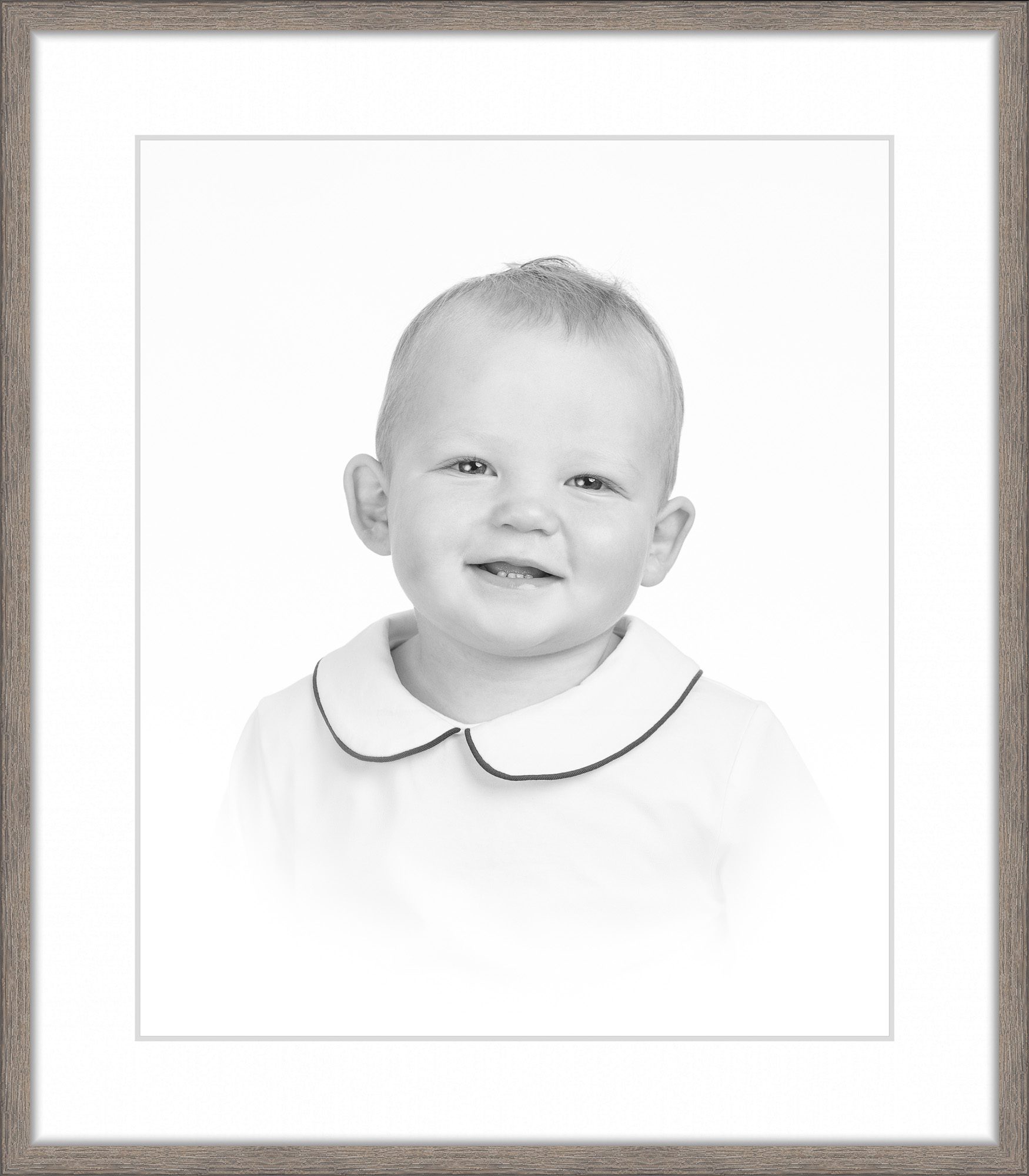 Smiling toddler in a white collared shirt during a classic studio portrait session with DC family photographer Lisa Maco