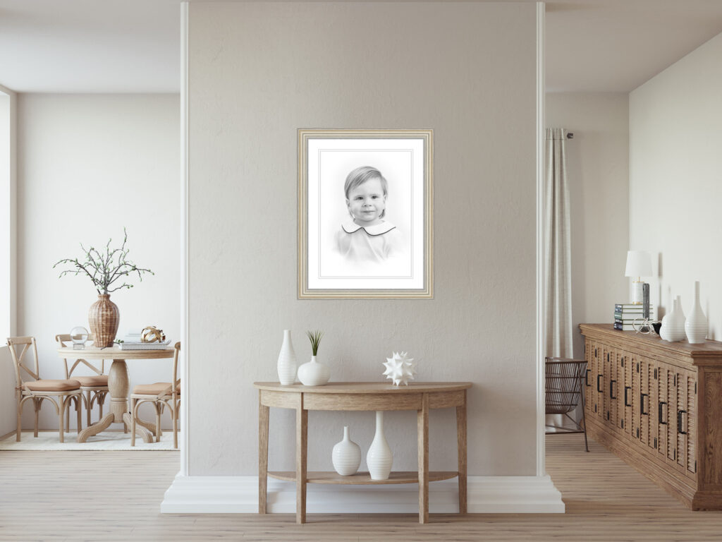 Framed pencil portrait displayed in a minimalist studio setting showcasing classic family photography styling by a DC studio photographer