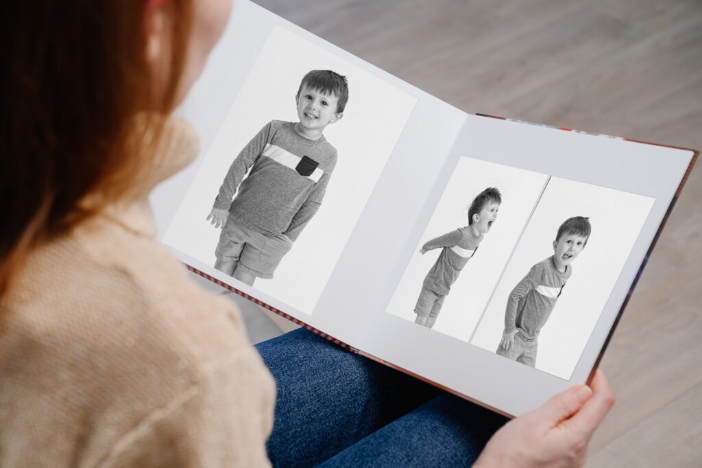 looking through a photo album of your young child