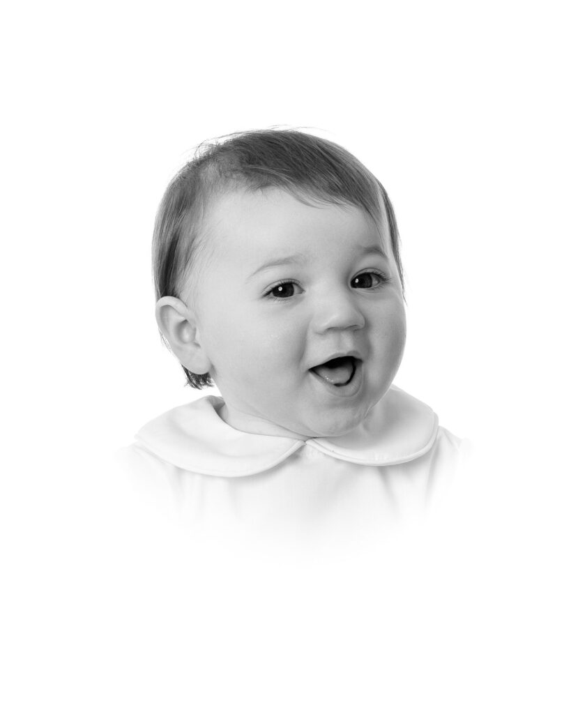 Joyful toddler in a classic white collar shirt during a studio portrait session with DC family photographer Lisa Maco